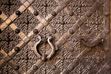 Old door with ornament in Royal Wawel Castle, Kracow, Poland. clipart